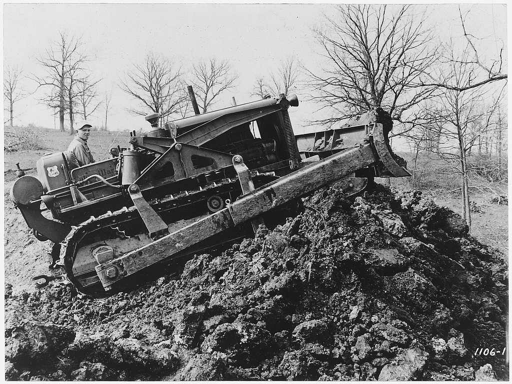 Photo of a bulldozer on a pile of dirt